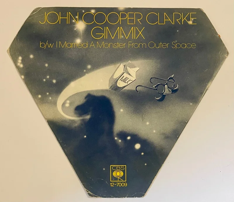 John Cooper Clarke - Gimmix 7" Vinyl (Shaped Orange Vinyl)