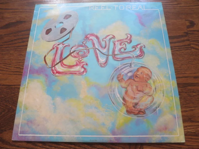 Love - Reel To Real